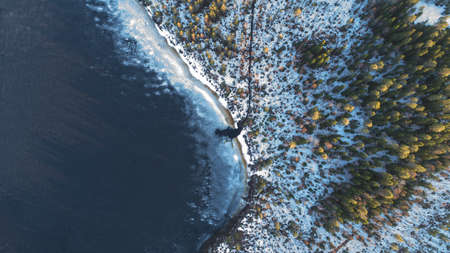 Drone view on river with melting ice, sunny spring weather.の写真素材