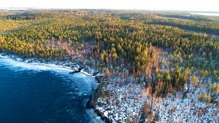 Drone view on river with melting ice, sunny spring weather.の写真素材