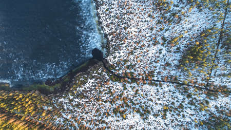 Drone view on river with melting ice, sunny spring weather.の写真素材