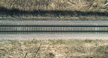 Aerial drone view of an railroad across the spring forest. Rural placesの写真素材