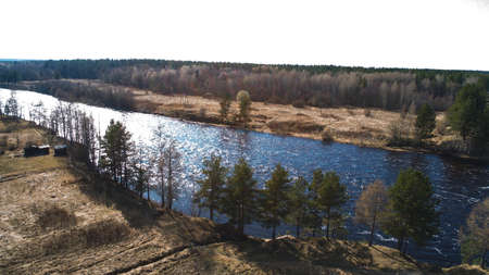 Amazing aerial shot of beautiful dark river shore.の写真素材