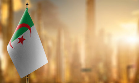 Small flags of the Algeria on an abstract blurry background.の写真素材