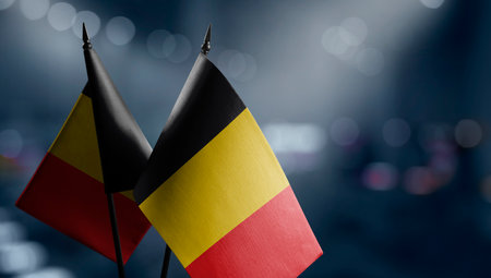 Small flags of the Belgium on an abstract blurry background.の写真素材