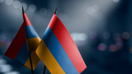 Small flags of Armenia on an abstract blurry background.の写真素材