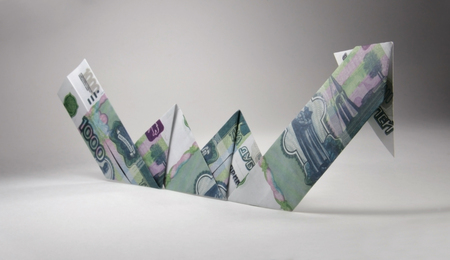 Arrow origami made of rubles bills on a white background