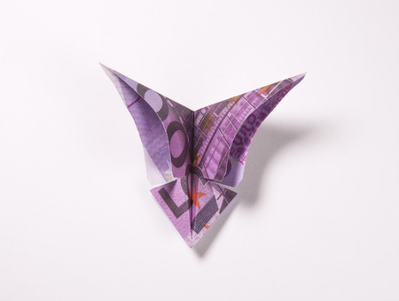 Origami butterfly made out of euro billsの写真素材