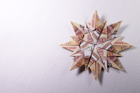 snowflake origami made of banknotes rubles. Handmadeの写真素材