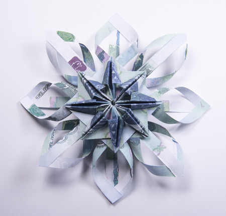 snowflake origami made of banknotes rubles. Handmadeの写真素材