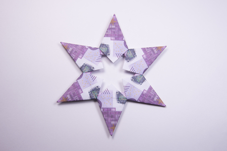 snowflake origami made of banknotes euro. Handmadeの写真素材