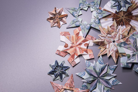 snowflake origami made of banknotes rubles. Handmadeの写真素材