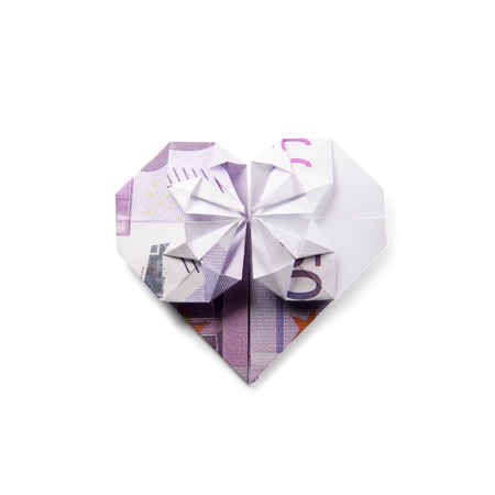 origami heart of banknotes on a white backgroundの写真素材