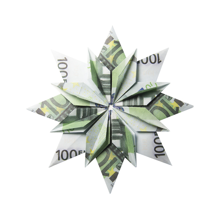 snowflake origami made of banknotes on a white background. Handmadeの写真素材