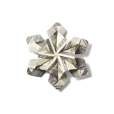 snowflake origami made of banknotes on a white background. Handmadeの写真素材