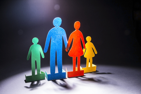 the family of colored paper on a dark background.