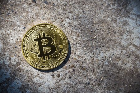 Gold coin Bitcoin on the stone background.の写真素材