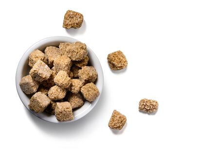 brown lump sugar on white backgroundの写真素材