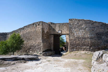 Large Central gate in the cave city of Chufut-Kale in the Republic of Crimea, Russia. A clear Sunny day on September 28, 2020のeditorial素材