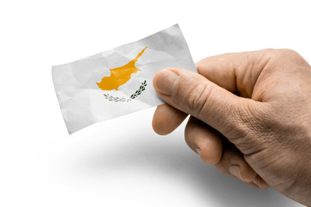 Hand holding a card with a national flag the Cyprusの写真素材