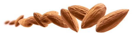 Almond nuts levitate on a white backgroundの写真素材