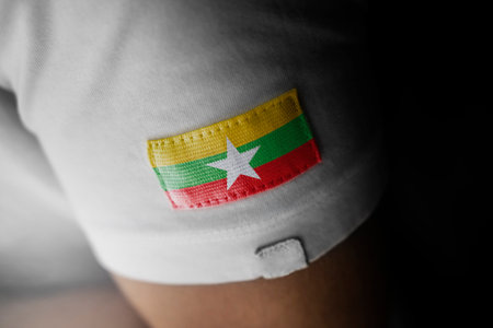 Patch of the national flag of the Myanmar on a white t-shirtの写真素材