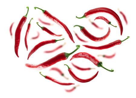Red hot pepper in the shape of a heart on a white background
