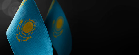 Small national flags of the Kazakhstan on a dark backgroundの写真素材