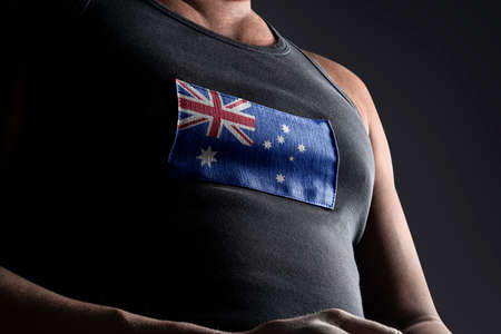 The national flag of Australia on the athletes chestの写真素材