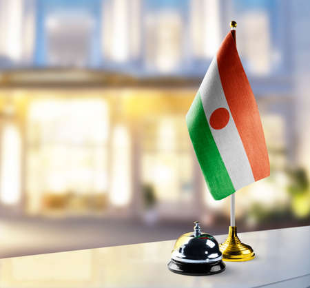 Niger flag on the reception desk in the lobby of the hotelの写真素材