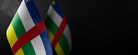 Small national flags of the Central African Republic on a dark backgroundの写真素材