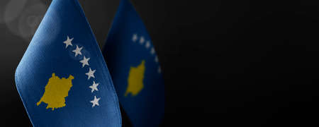 Small national flags of the Kosovo on a dark backgroundの写真素材