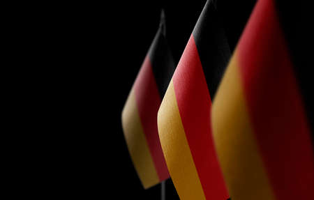 Small national flags of the Germany on a black backgroundの写真素材