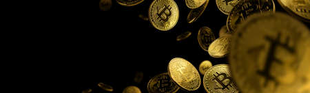 Gold coin Bitcoin levitates on a black backgroundの写真素材