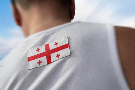The national flag of Georgia on the athletes back