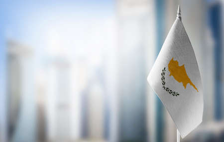 A small flag of Cyprus on the background of a blurred backgroundの写真素材