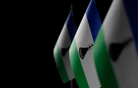 Small national flags of the Lesotho on a black backgroundの写真素材