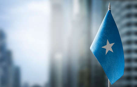 A small flag of Somalia on the background of a blurred background