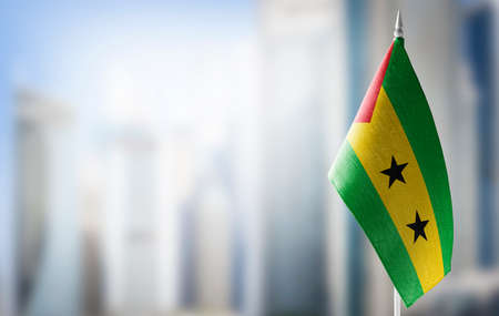 A small flag of Sao Tome and Principe on the background of a blurred backgroundの写真素材