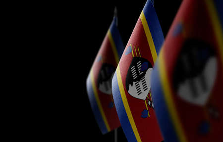 Small national flags of the Swaziland on a black backgroundの写真素材
