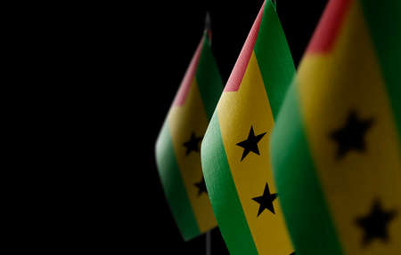 Small national flags of the Sao Tome and Principe on a black backgroundの写真素材