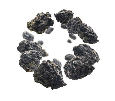 Green oolong tea levitates on white backgroundの写真素材