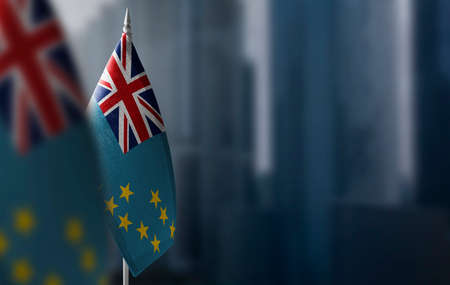 Small flags of Tuvalu on a blurry background of the cityの写真素材