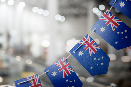 A garland of Australia national flags on an abstract blurred backgroundの写真素材