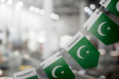 A garland of Pakistan national flags on an abstract blurred background.の写真素材