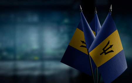 Small flags of the Barbados on an abstract blurry background.の写真素材