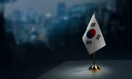 Small flags of the South Korean on an abstract blurry background.の写真素材