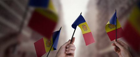 A group of people holding small flags of the Andorra in their hands.の写真素材