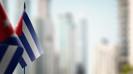 Small flags of the Cuba on an abstract blurry background.の写真素材
