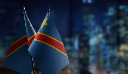 Small flags of the Democratic Republic of the Congo on an abstract blurry background.の写真素材