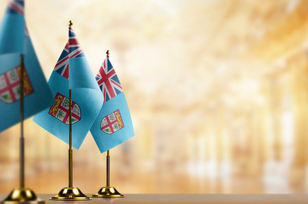 Small flags of the Fiji on an abstract blurry background.の写真素材
