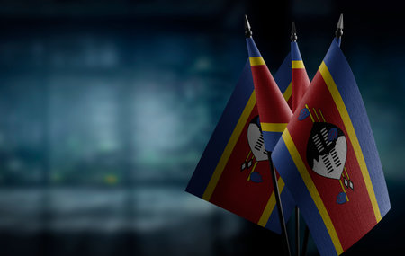 Small flags of the Swaziland on an abstract blurry background.の写真素材